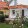 Terrassendach in Lärchenholz mit Glas-Eindeckung und Textil-Beschattung